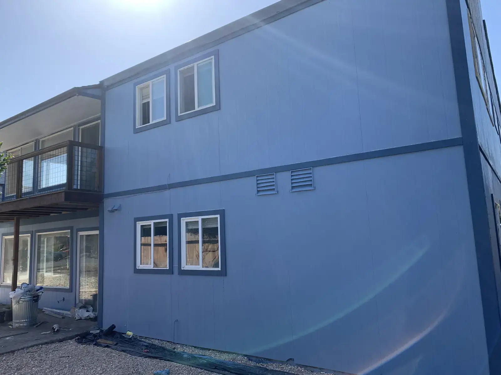 Rear elevation of the finished Arcata apartment building with new second-floor balconies