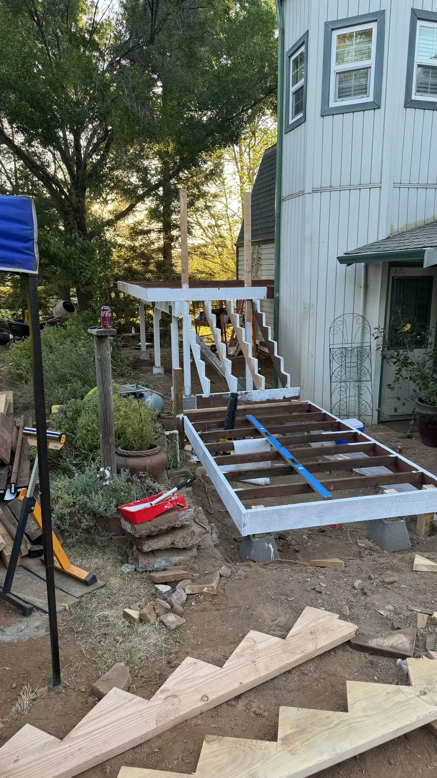 Deck framing with new stair stringers cut and set